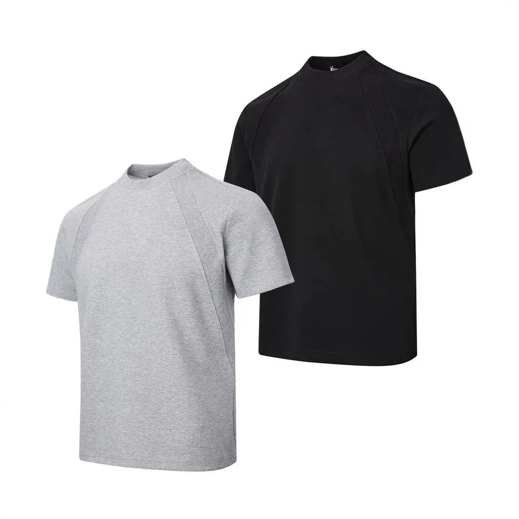 Man wearing a loose grey short sleeve top with visible air layer texture stitching on the front.