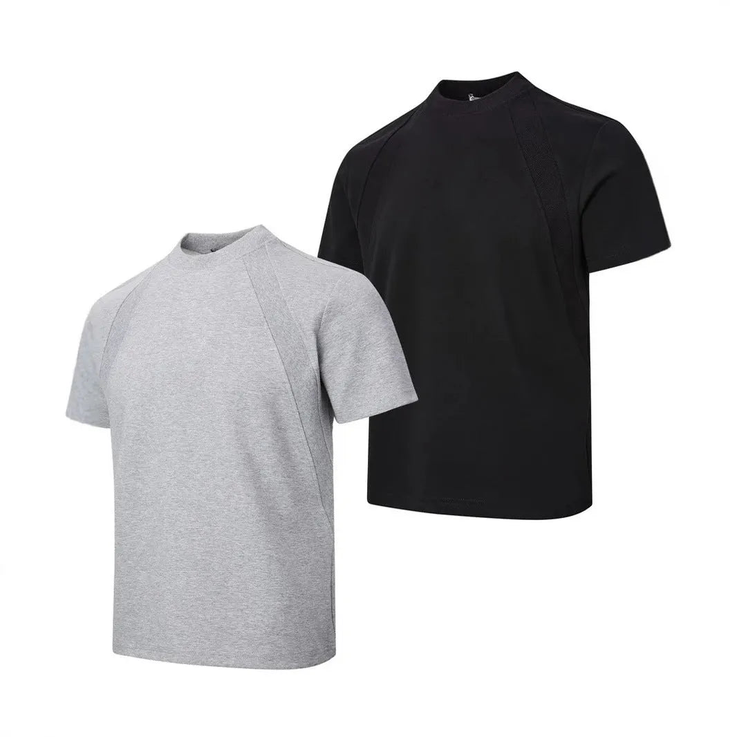 Man wearing a loose grey short sleeve top with visible air layer texture stitching on the front.
