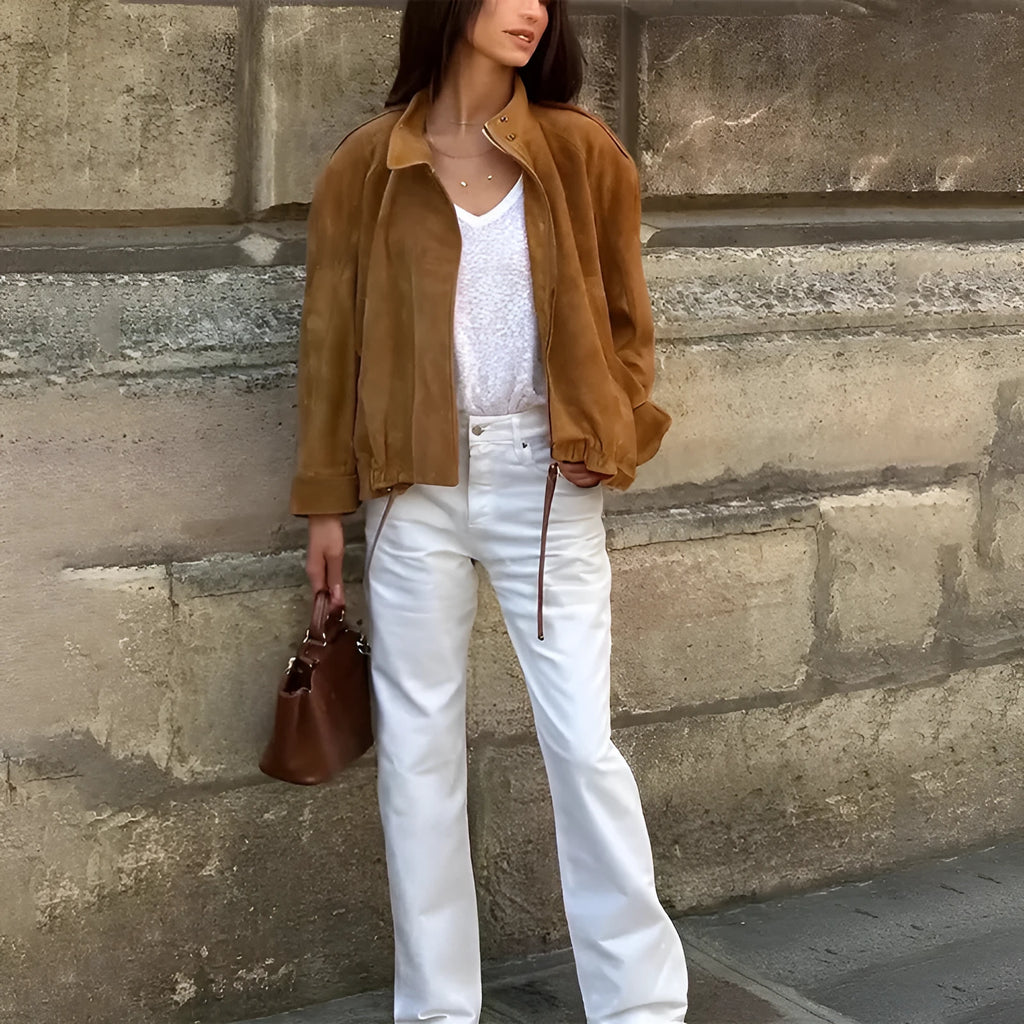 Solid colour loose-fit retro jacket with long sleeves on a hanger.