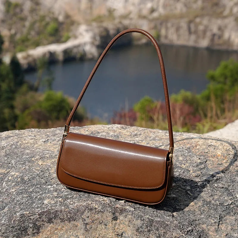 Genuine leather women's saddle bag in caramel, horizontal square shape with double straps