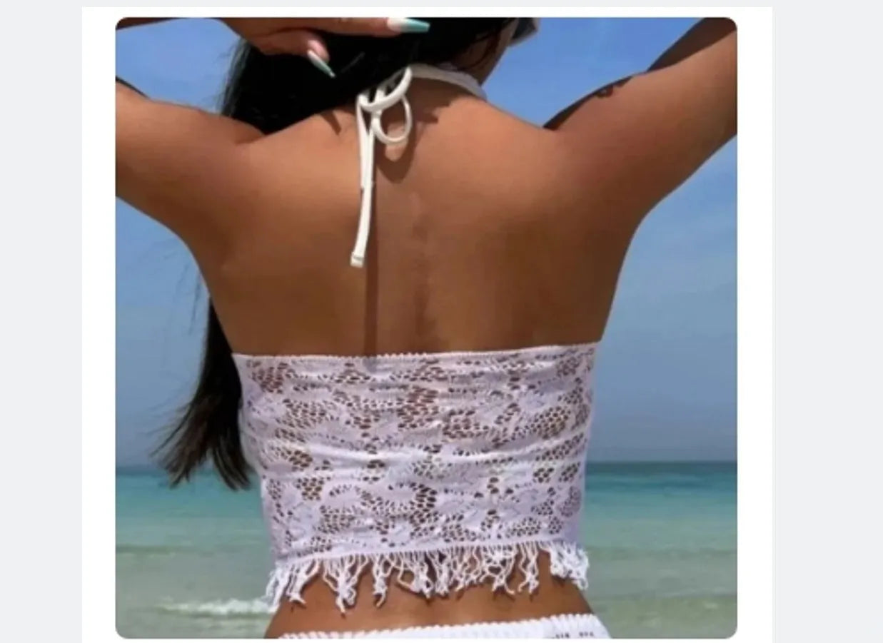 Women's black and white two-piece bikini swimsuit set with lace cover-up skirt