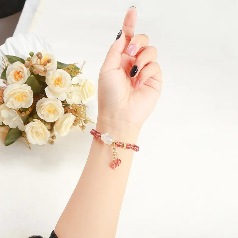 Women's strawberry quartz agate bracelet with 6mm geometric beads and White Rabbit design