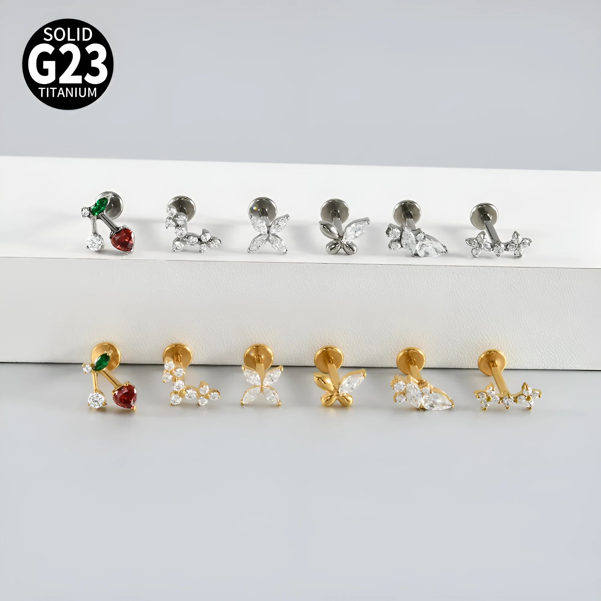 G23 titanium stud earrings with cherry zircon butterfly flower design, 1.2x8mm, gold electroplated finish