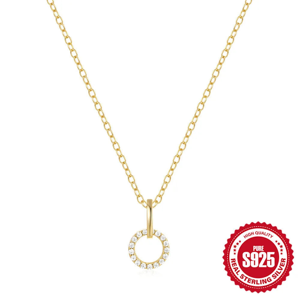 Gold geometric pendant necklace on a model, showing the interlocking design and adjustable clavicle chain.
