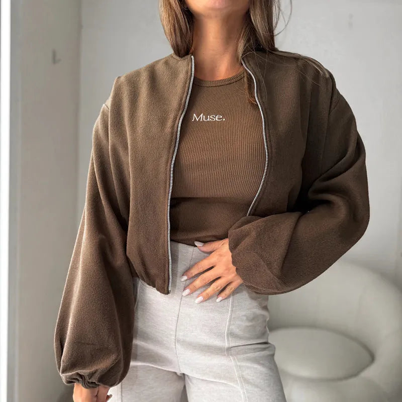 Women's milky white off-shoulder jacket with long lantern sleeves and pockets.