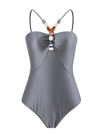 Women's one-piece swimsuit with hollow gem sling design in sapphire blue colour