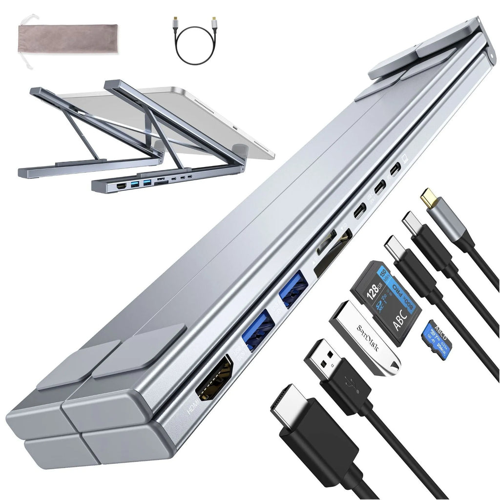 Aluminium alloy folding laptop docking station and stand in silver, shown with multiple USB and HDMI ports.