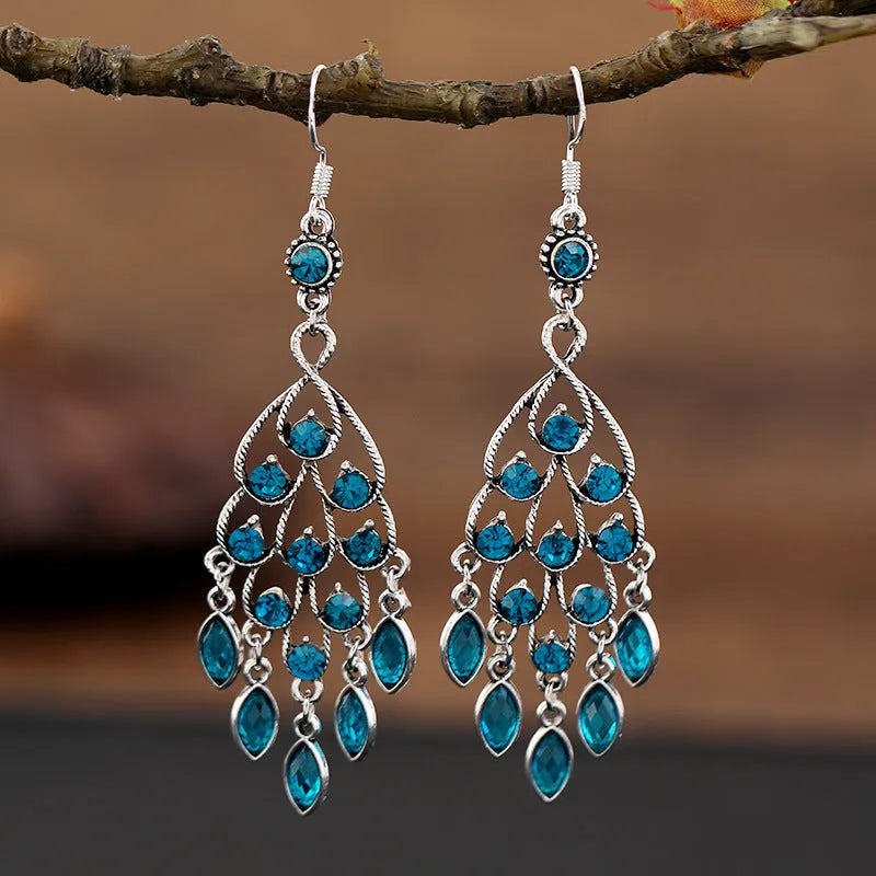 Purple water drop shaped retro earrings with long fringe detailing and ethnic style elements