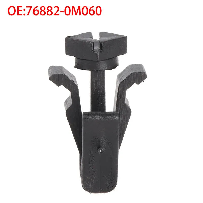 Black plastic bumper cover radiator grille fastening clip for Nissan vehicles, part number 76882-0M060
