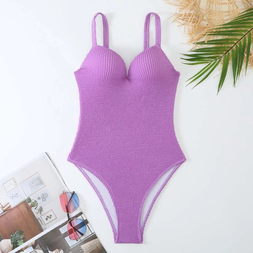 Women's sleeveless one-piece swimsuit in a striped design, shown in one of five available colours.