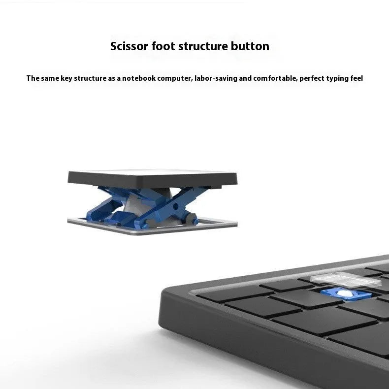 Black and grey wireless Bluetooth keyboard with touchpad next to its leather sheath stand.