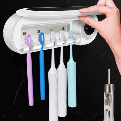 Wall-mounted toothbrush holder with UV sterilizer and toothpaste dispenser in ivory white