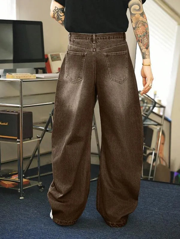 Men's brown washed loose flared jeans with low waist and zipper fly, side view