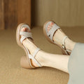 Women's apricot open toe platform sandals with an adjustable strap on a white background.