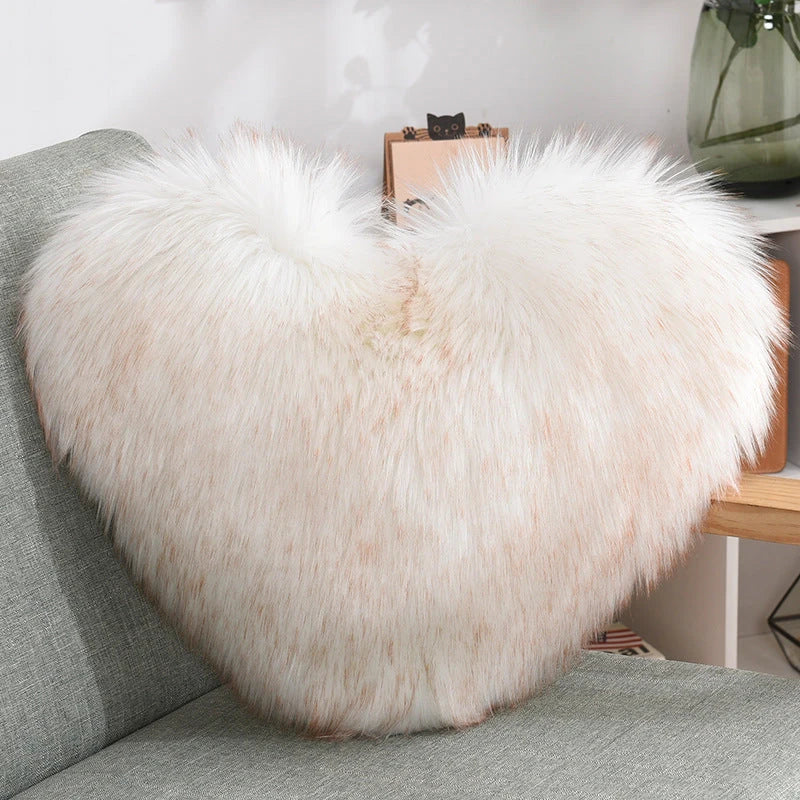 Plush heart-shaped throw pillows in various colors and styles for cozy sofa decor