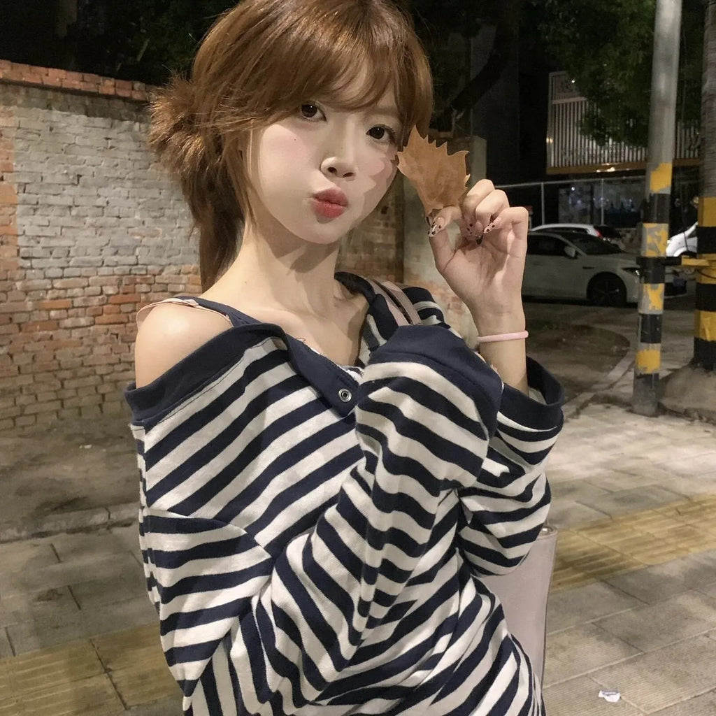 Dark blue Korean-style oversized women's t-shirt with long sleeves, stripes, and embroidery details.