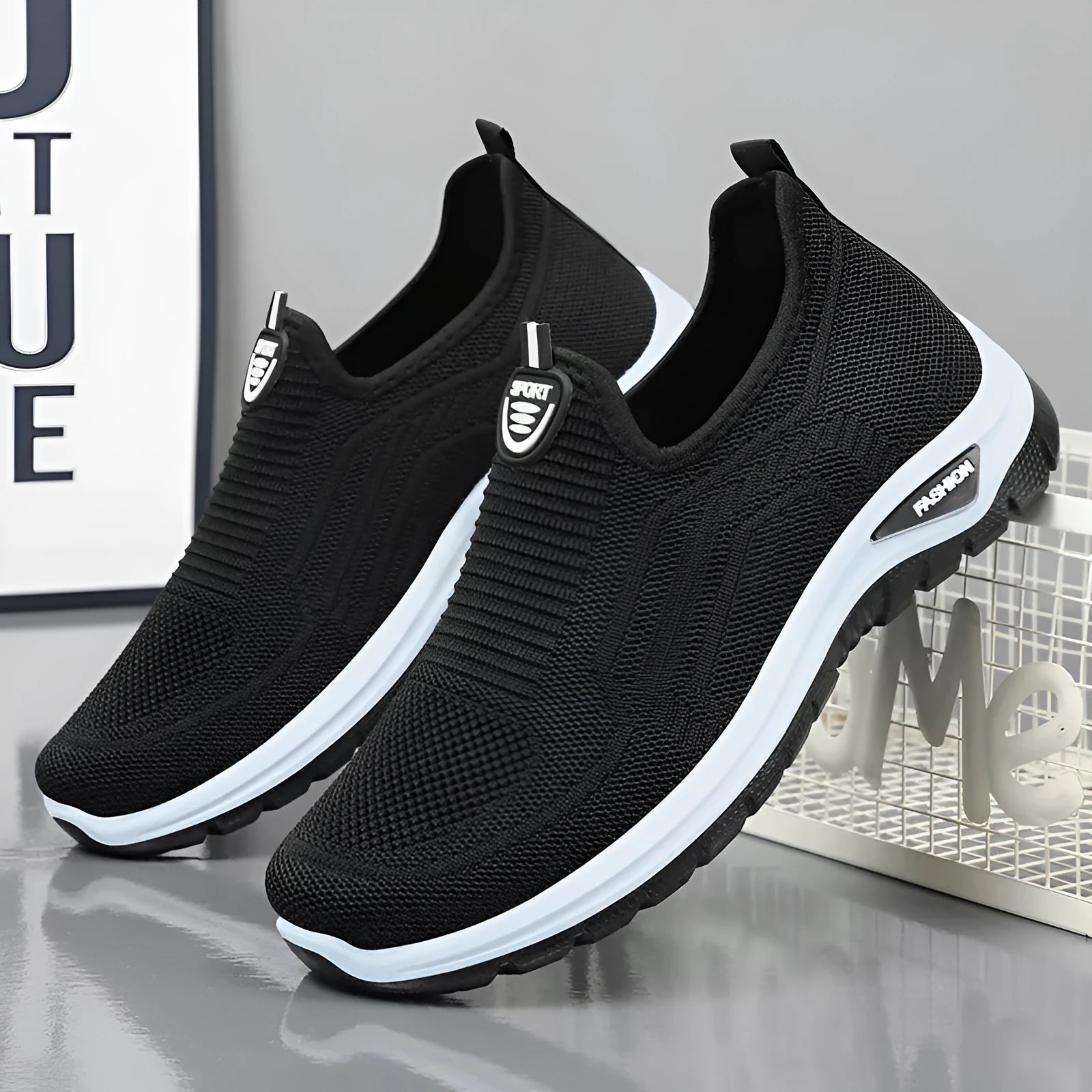 Men's grey breathable casual slip-on shoes with mesh detailing and a round toe.