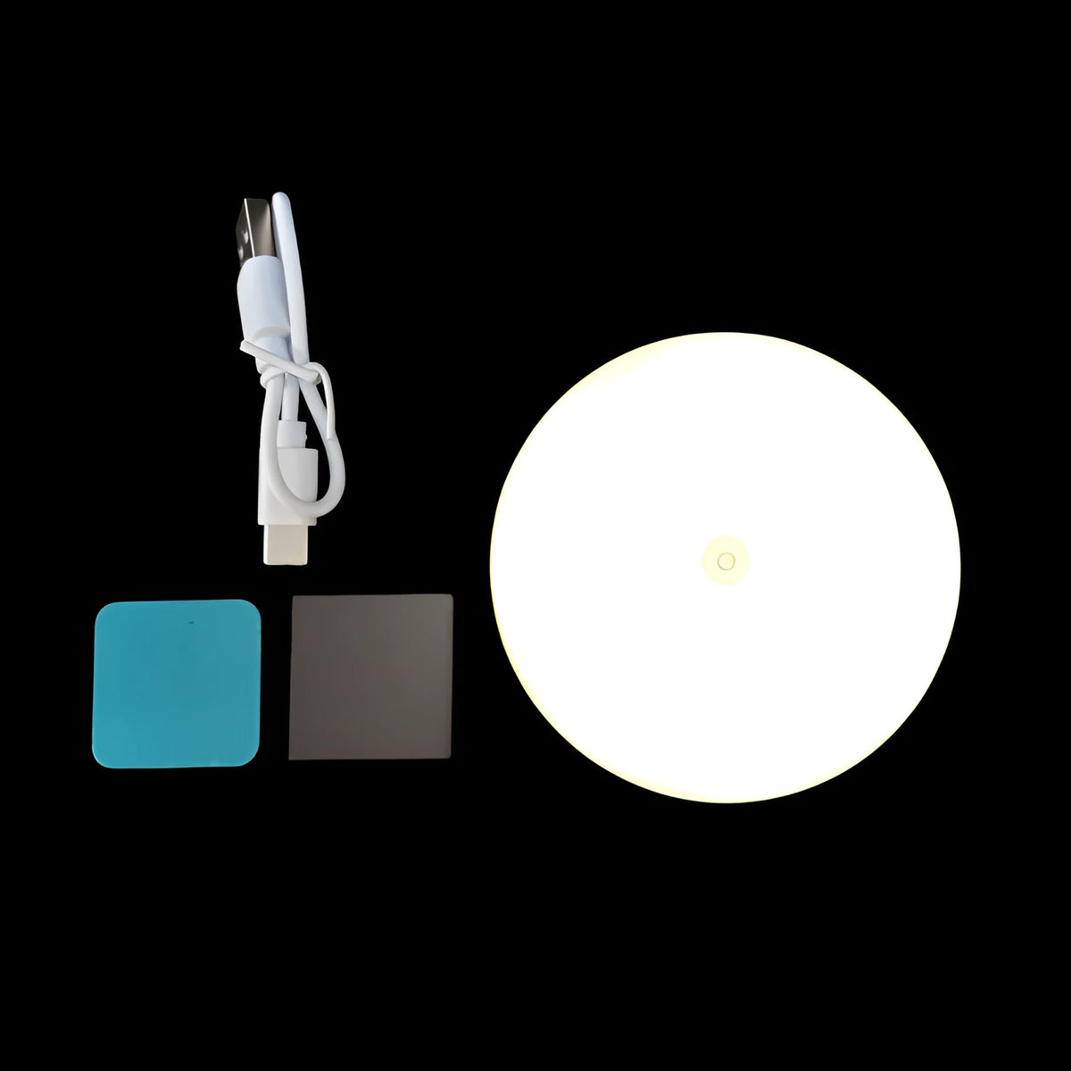 Round small night lamp with side push key, 86mm diameter, white housing, glowing warm light on a wooden nightstand