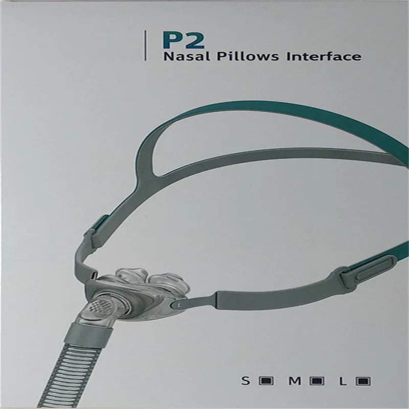 Ventilator nasal pillow mask kit showing silicone cushion, nose pad, and adjustable headband on a white background.