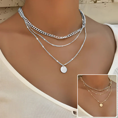 Women's multilayer alloy necklace with 2.5 cm disc pendant on 40-50 cm electroplated chains in gold or silver