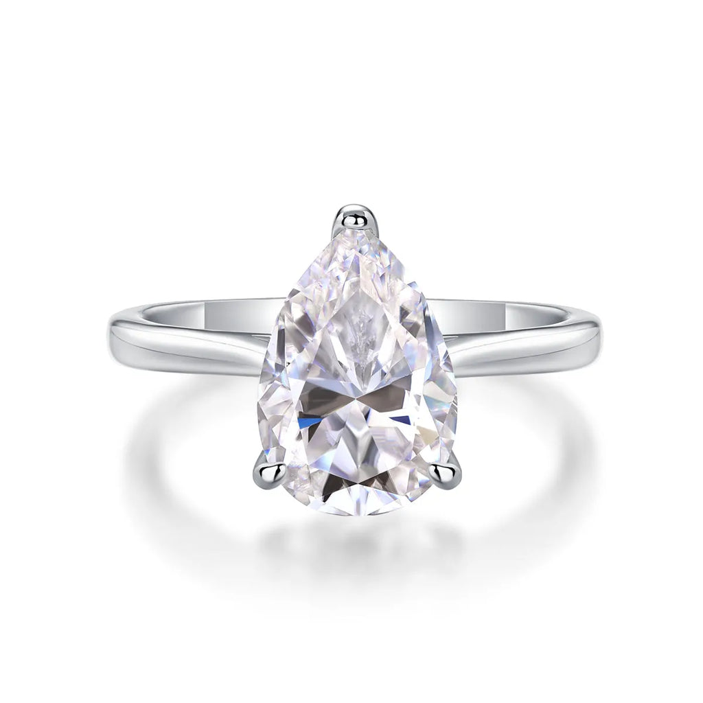 Heart-shaped pear-cut moissanite wedding ring set in S925 silver with platinum plating on white background