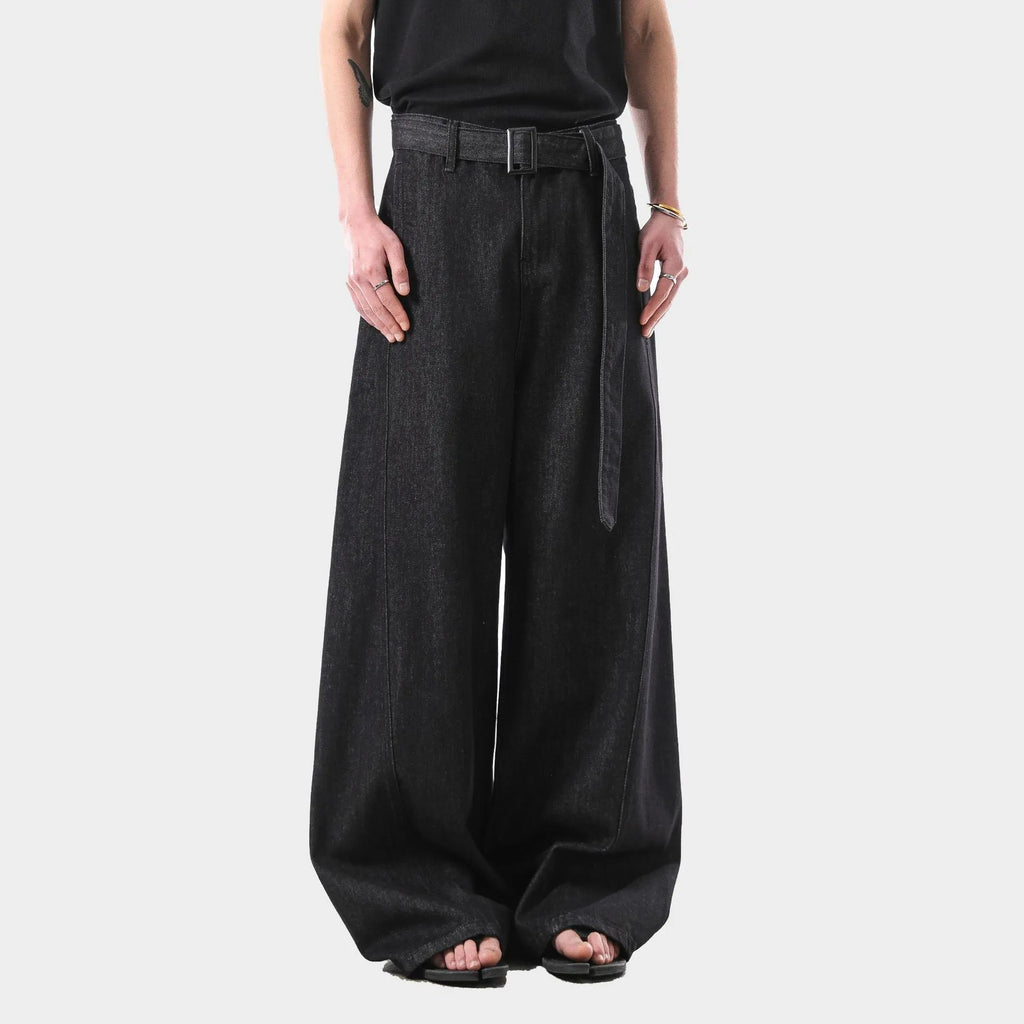 Black women's high-waist straight-leg jeans with gold stitching and a zip fly closure.