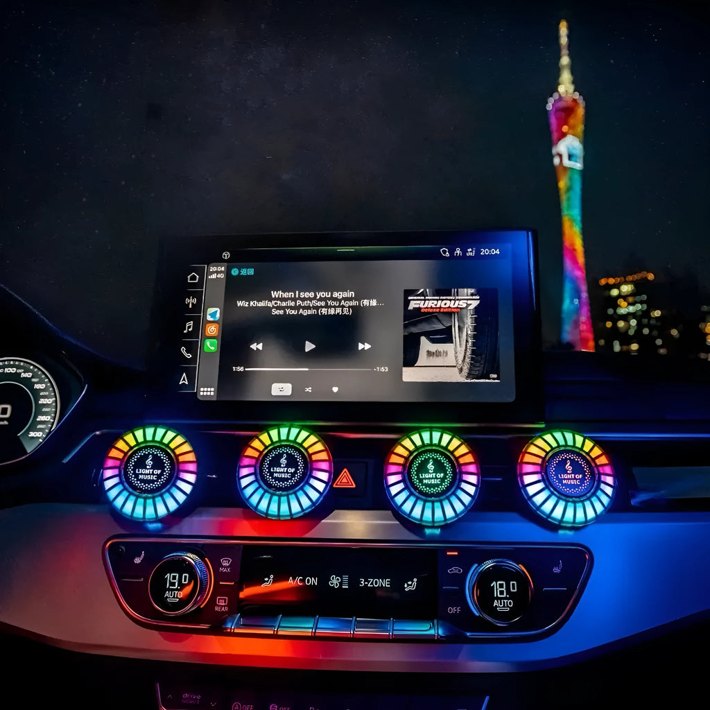 RGB car air outlet aromatherapy light with 3D rhythm effects mounted in a car vent.