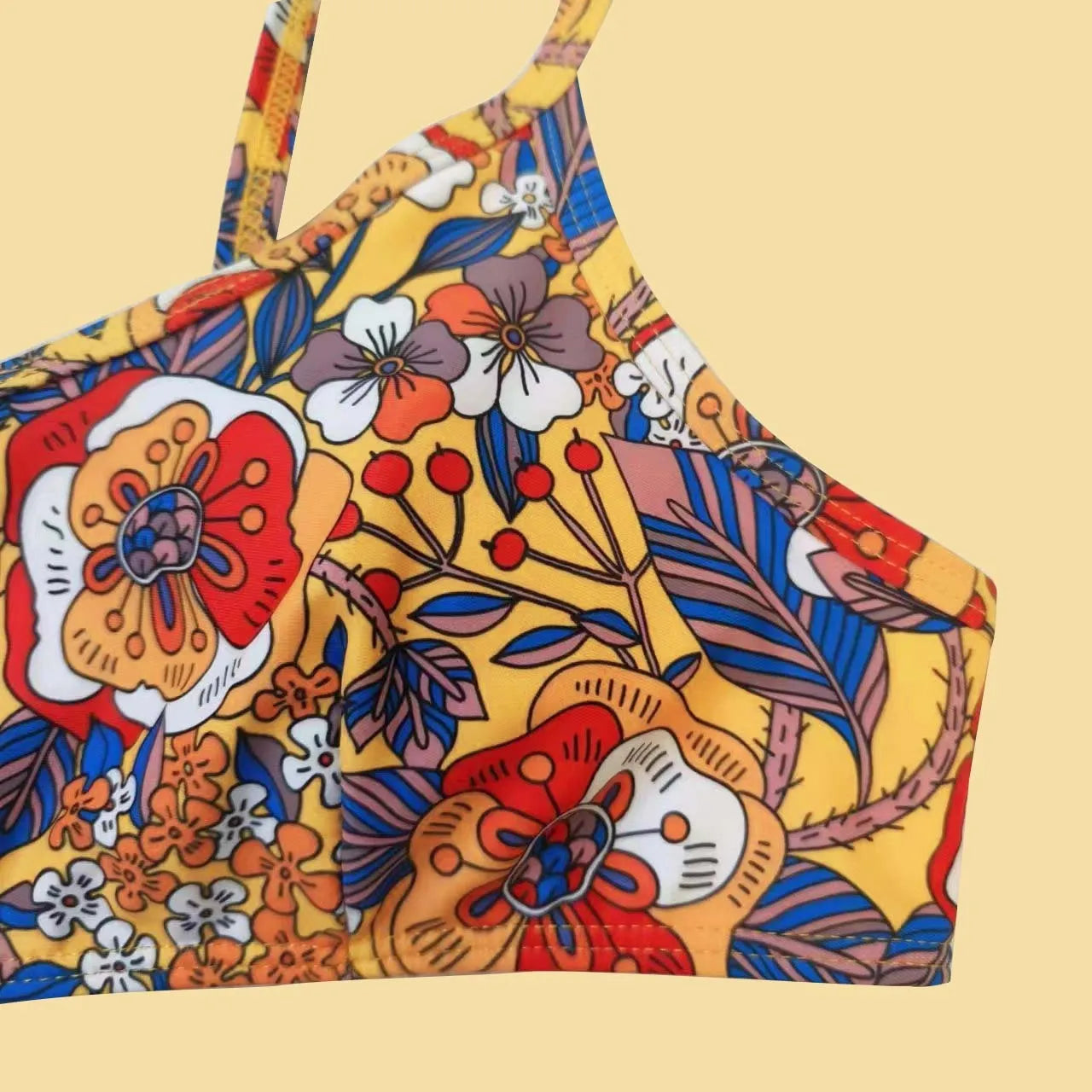 Plus size women's floral print bikini swimsuit with strap design on white background