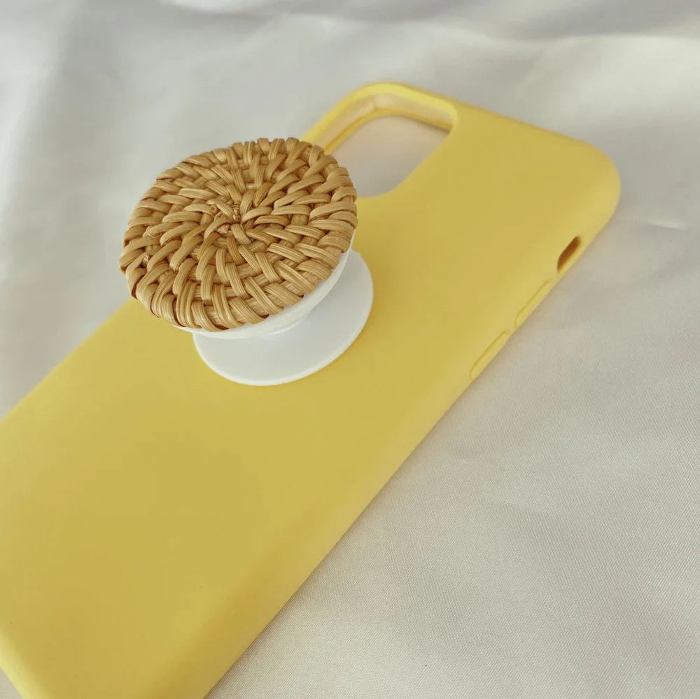 Bamboo woven telescopic phone stand extended to 25cm height holding smartphone