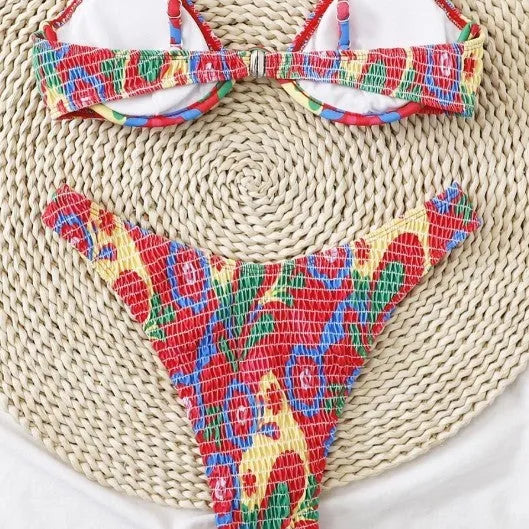 Red floral pattern women's underwire triangle bikini with briefs-style bottom on mannequin