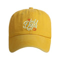 Washed cotton baseball cap with embroidered letters on the front, shown in a blue colour with an adjustable back strap.