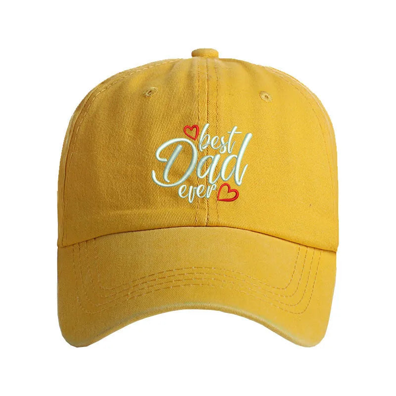Washed cotton baseball cap with embroidered letters on the front, shown in a blue colour with an adjustable back strap.
