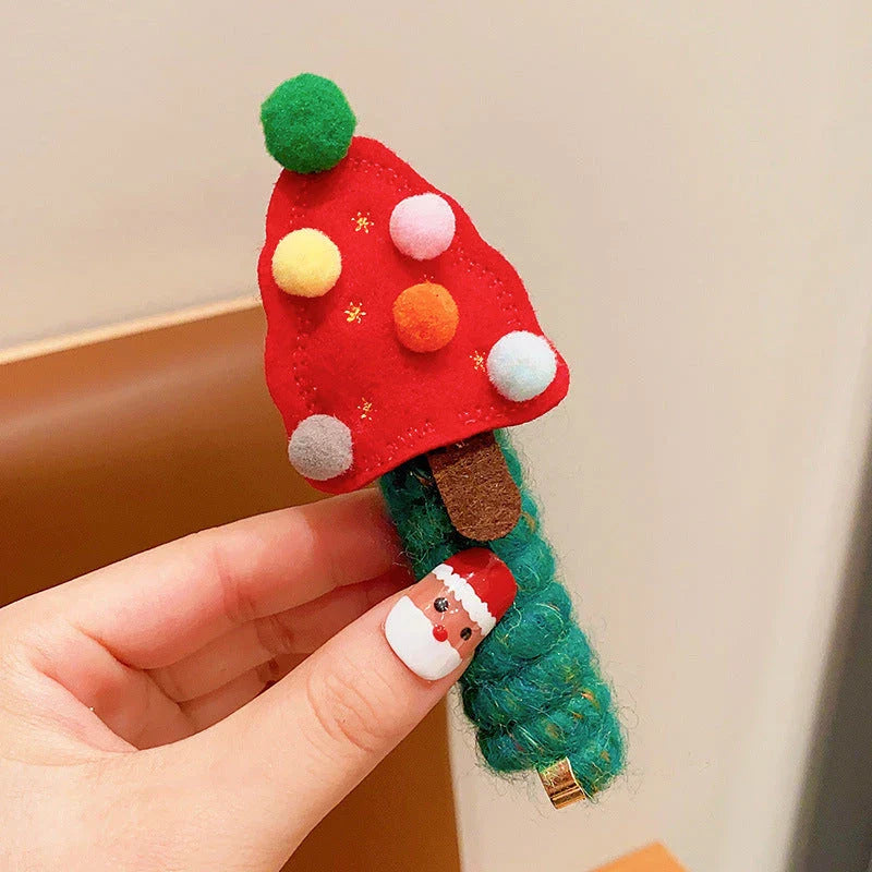 Festive Christmas hair ties for girls in various holiday-themed designs, including red bells, green trees, and khaki deer.