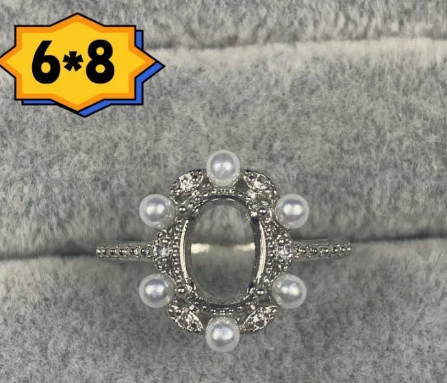 Oval denier ring with open mouth design showing 6*8mm main stone and five-pointed star decoration