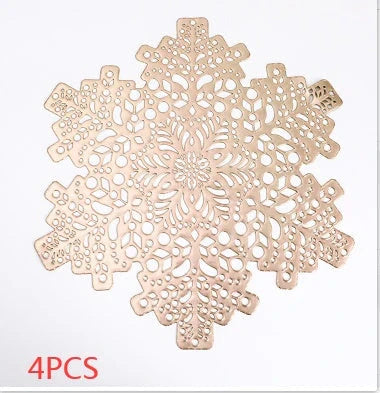 Stylish snowflake-patterned placemats in gold and silver, designed for heat resistance and spill protection on dining tables