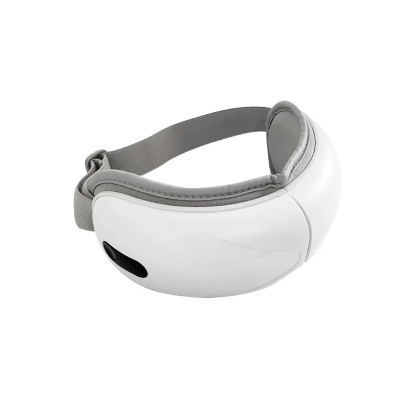 White rechargeable airbag massage eye massager with hot compress function on grey background