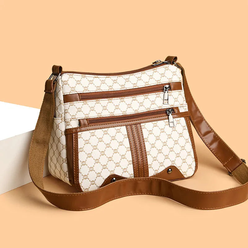 Brown women's crossbody bag with stitching pattern detailing and large storage capacity