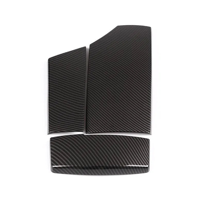 Three ABS armrest box protective covers with carbon fibre weave pattern showing polished surface