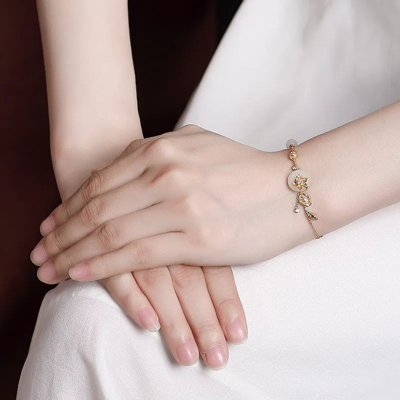 Women's Hetian jade and 925 silver peace buckle bracelet with lotus motif