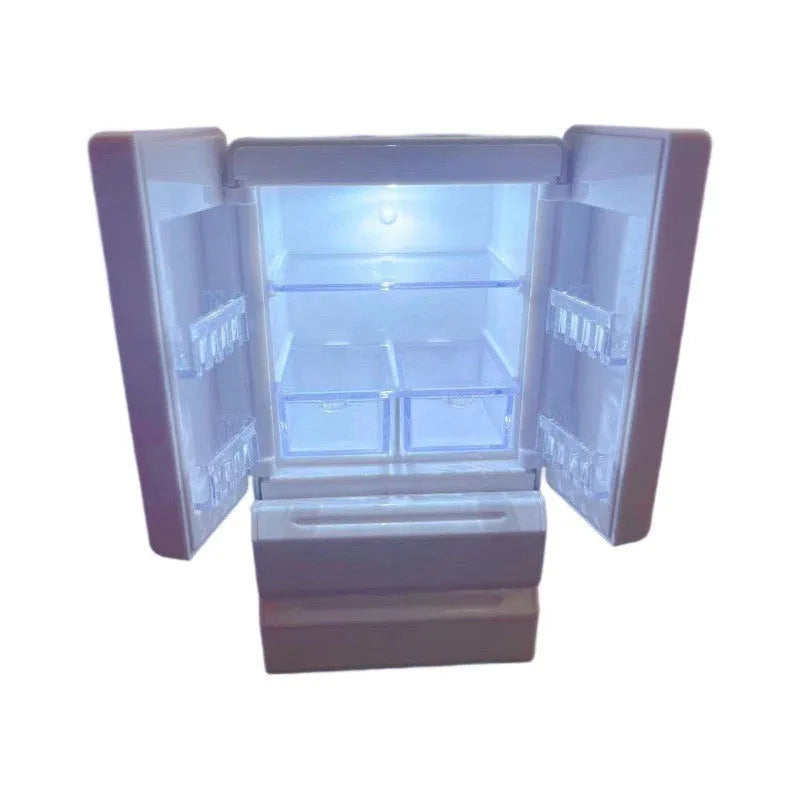 White plastic miniature candy toy model with illuminated light feature on a display surface.