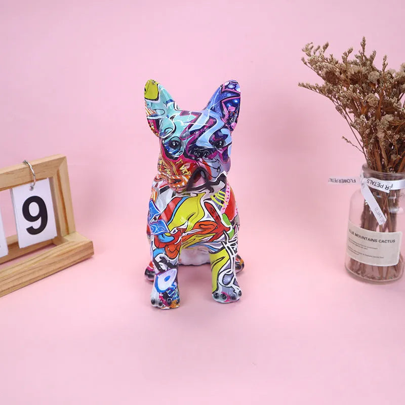 Modern simple French bulldog resin statue in graffiti colour finish on a plain background.
