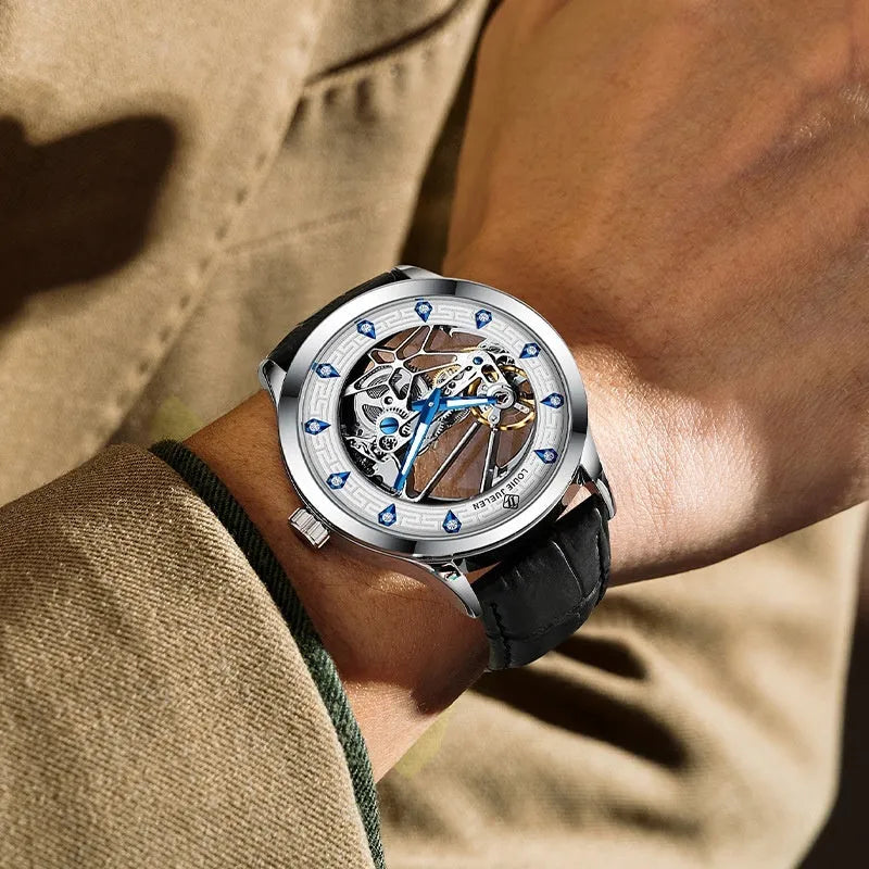 Men's silver mechanical watch with white dial, blue luminous hands, and a black leather strap