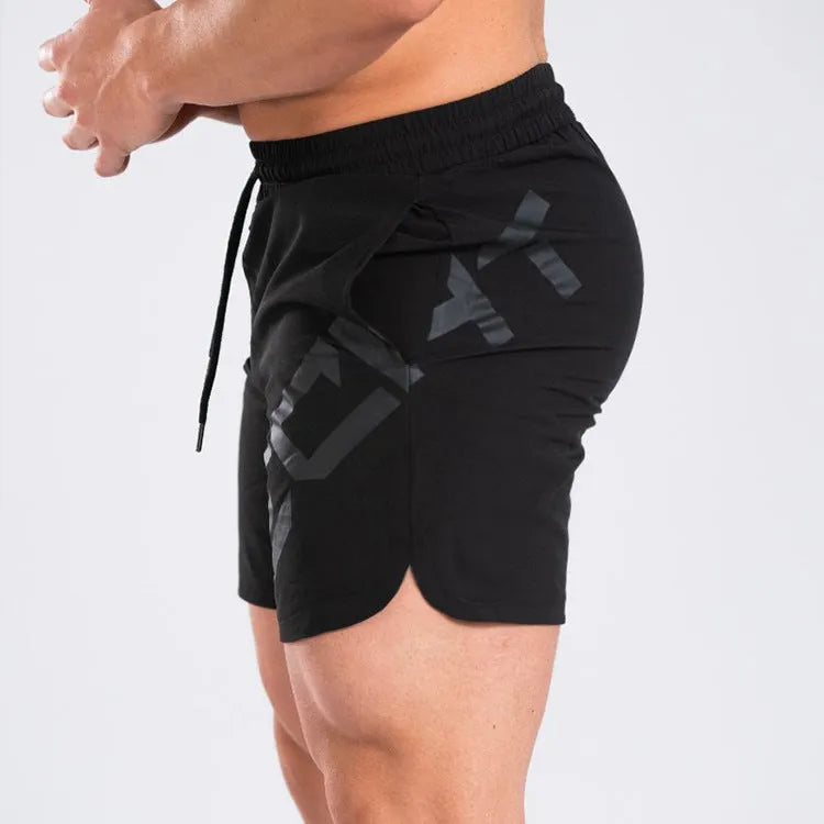 Men's black elastic nylon quick-dry running shorts on a mid-waist, knee-length model.