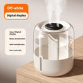 Beige round USB humidifier with dual spray nozzles, humidity display, and night light on a wooden surface.