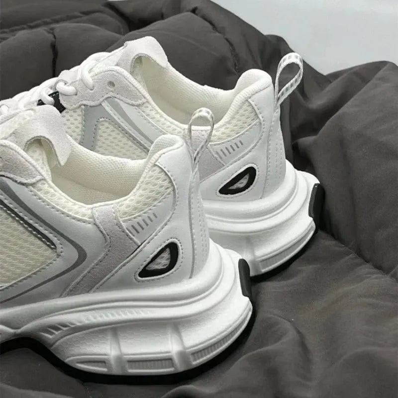 Beige mesh platform sports shoes with a wedge heel and front lace-up fastening on a rubber sole.
