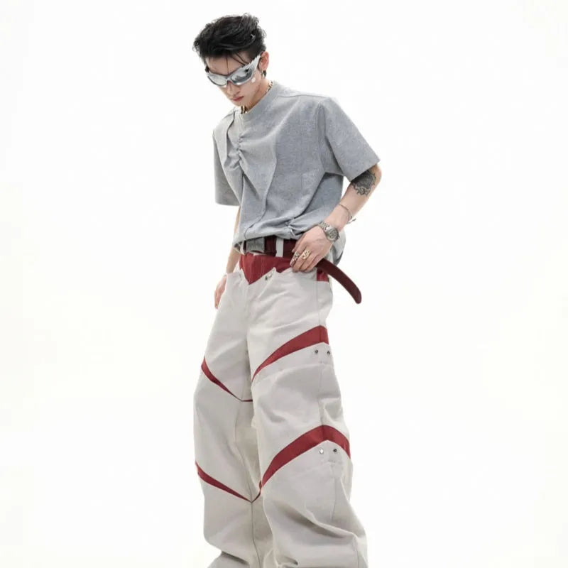 Men's grey loose fit cotton t-shirt with three-dimensional pleated texture detail on front.