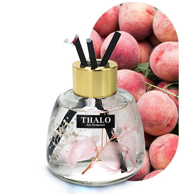 Glass bottle-shaped car perfume ornament for loose incense aromatherapy on a car dashboard.