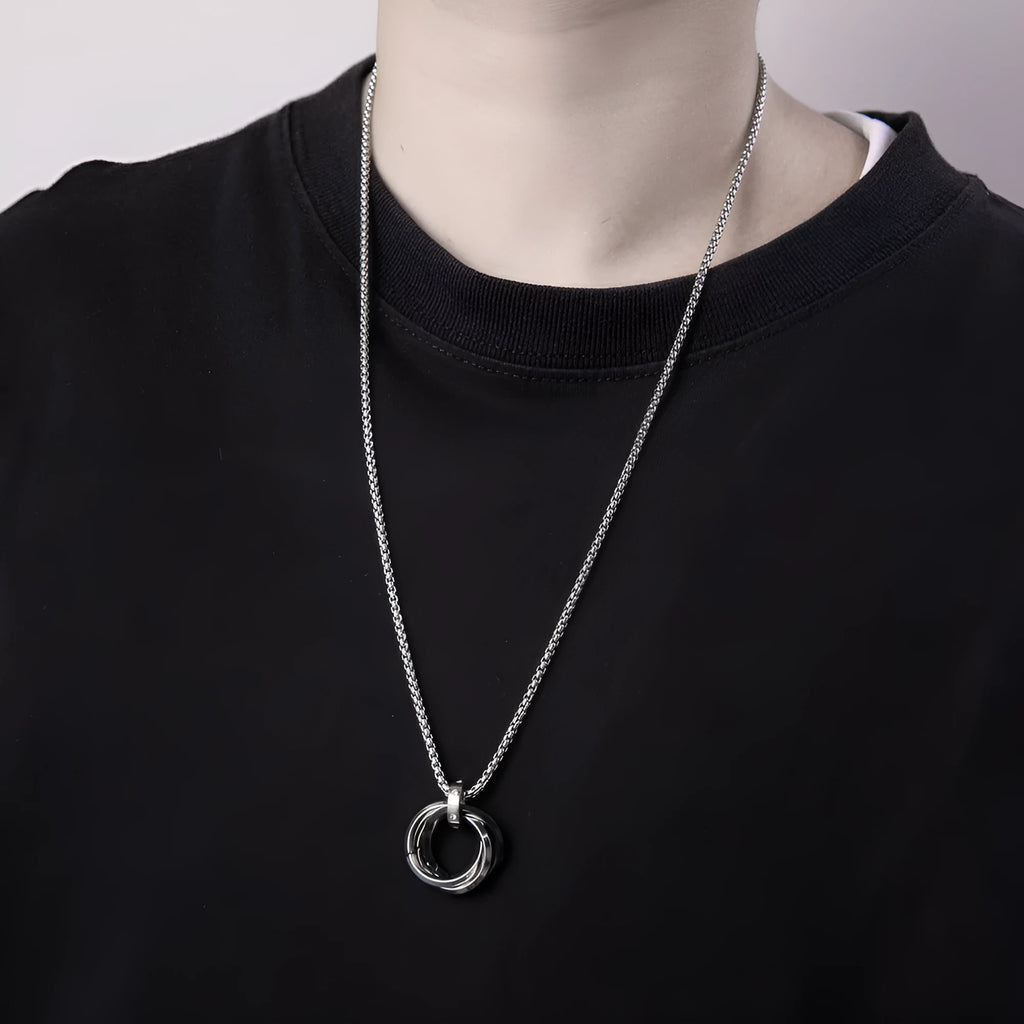 Men's geometric pendant necklace in titanium steel with electroplated black finish on a simple chain