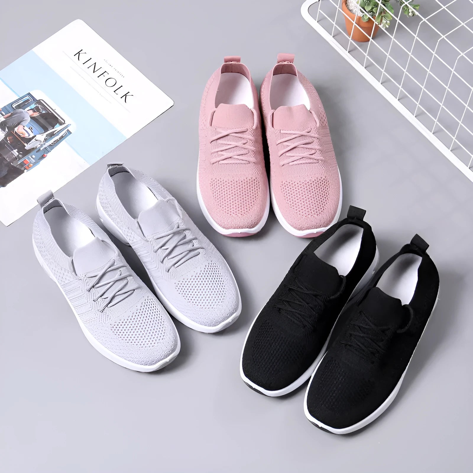 Women's casual mesh sneakers in black with round toe and lace-up front, showing PVC sole