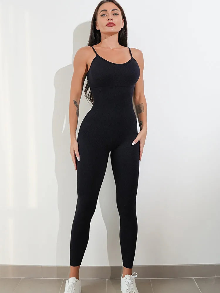 Women's black sleeveless jumpsuit with adjustable spaghetti straps and a backless design.